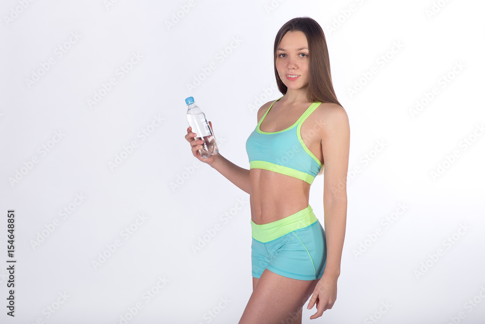 Female fitness athlete with bottle of water Female fitness athlete with bottle of water