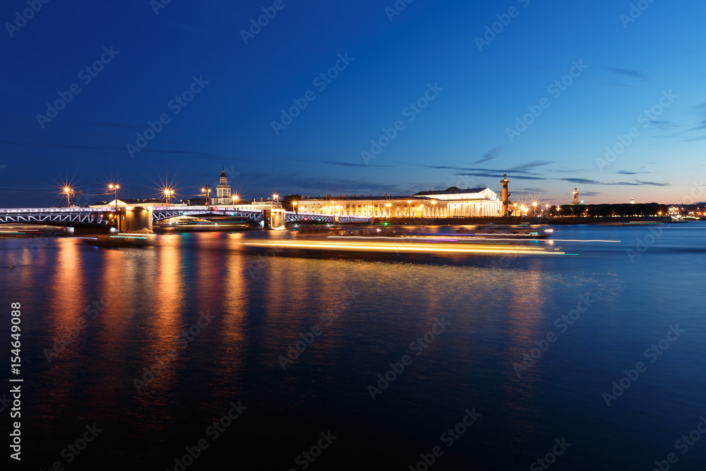 Night cityscape with river and bridge in Saint-Petersburg. Lantern lights on the bridge