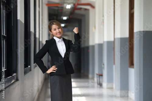portrait of asian businesswoman isolated on corridor background