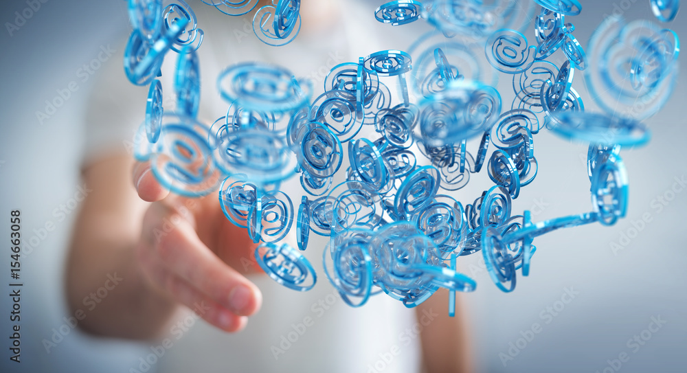 Businessman using digital arobase blue sphere to surf on internet 3D rendering Businessman using digital arobase blue sphere to surf on internet 3D rendering