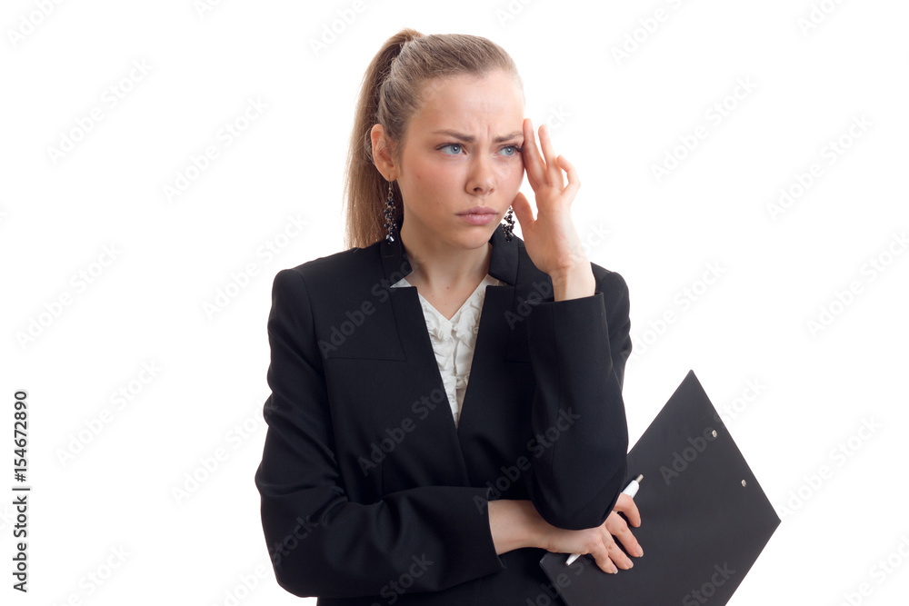 young beautiful blonde in black jacket and with the Tablet keeps the ball behind the head young beautiful blonde in black jacket and with the Tablet keeps the ball behind the head