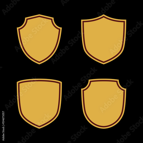 Shield shape gold icons set. Simple flat logo on black background. Symbol of security, protection, safety, strong. Element badge for protect design emblem decoration. Vector illustration