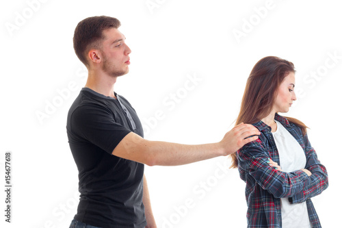 young high guy holds the girl's shoulder hand