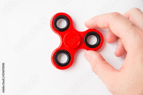 Принти на полотні Man holding a fidget spinner