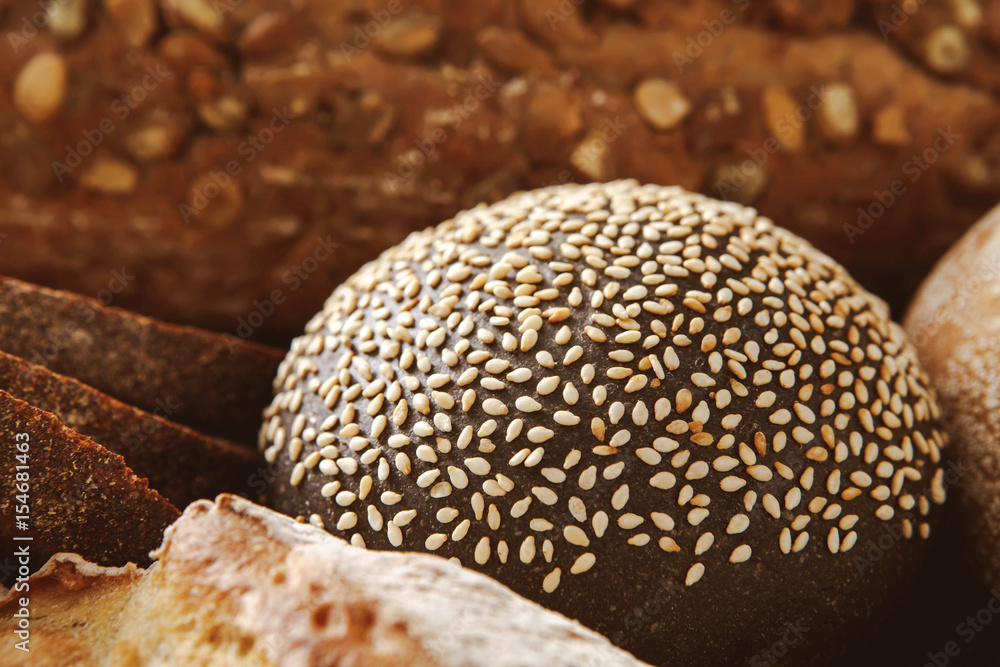 Bread background, closeup of white, black and rye loaves Bread background, closeup of white, black and rye loaves