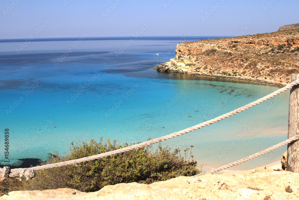 Pure crystalline water surface around an island - Lampedusa, Sicily