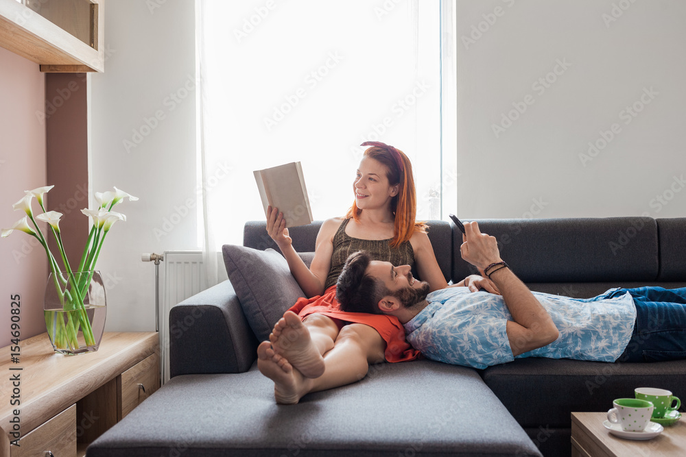 Young couple spending time in the living room Young couple spending time in the living room