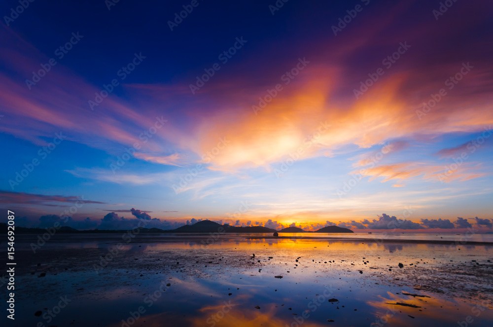 Harbor at dawn before sunrise in the morning created a colorful blue, purple and orange scenics in Sapanhin, Phuket island Thailand