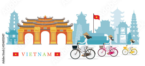 Vietnamese Women with Conical Hat Ride Bicycles, Landmarks Background
