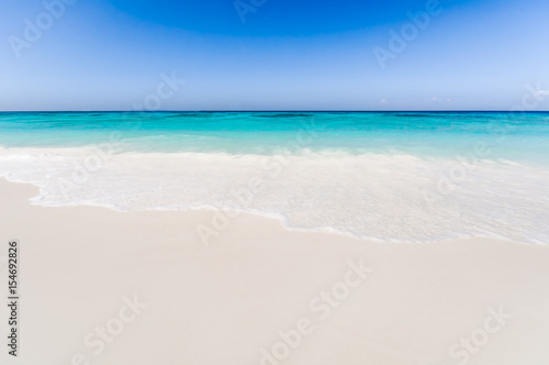 Beautiful tropical beach, white sand and blue sky background.