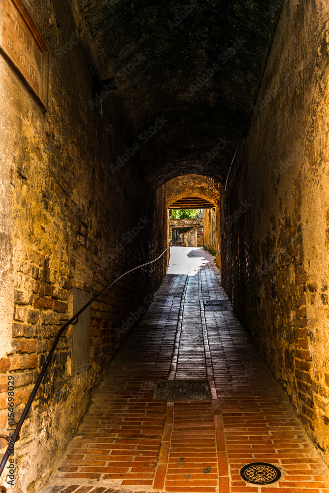 Small medieval streets of San Gimignano in Tuscany  - 6