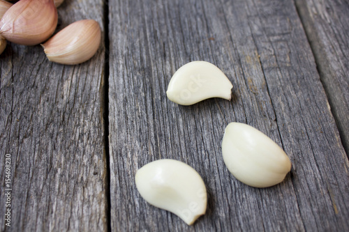 Fresh garlic on a wooden background.