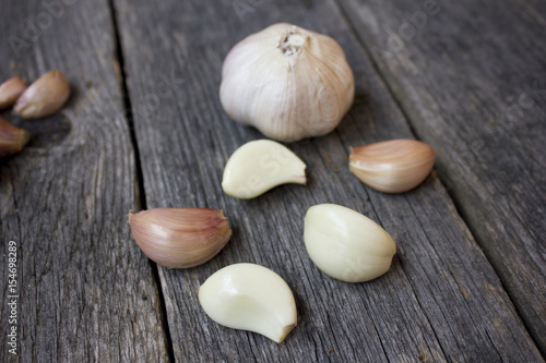 Fresh garlic on a wooden background.