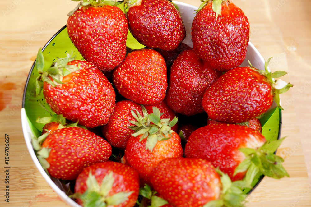 Bright fresh strawberry in a round container Bright fresh strawberry in a round container
