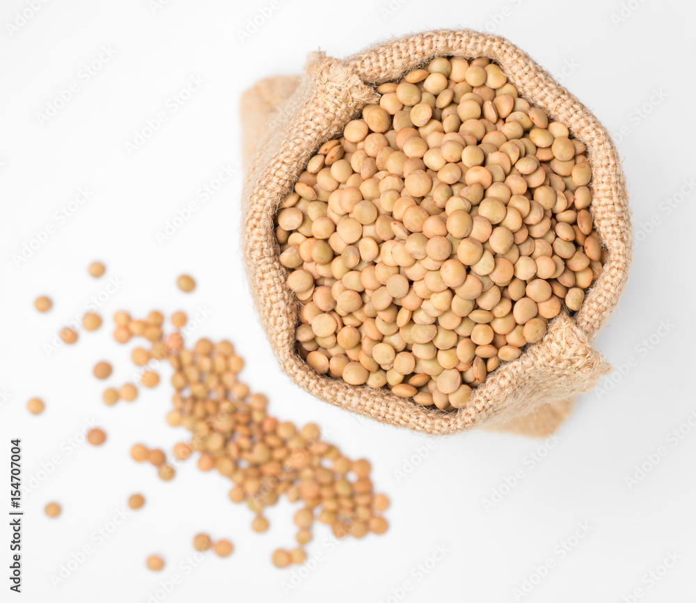 raw lentils on white, top view raw lentils on white, top view