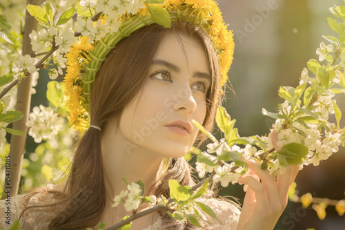 sensual girl portrait in spring flowers, toned image