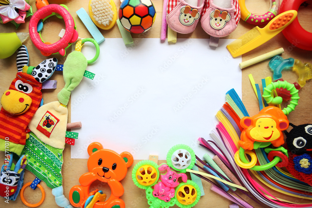 Obraz premium Children's toys and accessorieson a wooden background