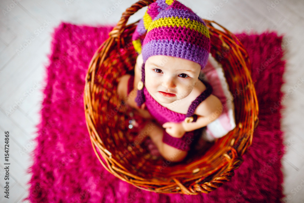 Look from above at little girl sitting in the basket Look from above at little girl sitting in the basket