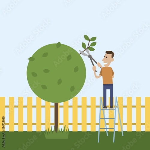 the man in the garden cuts wood