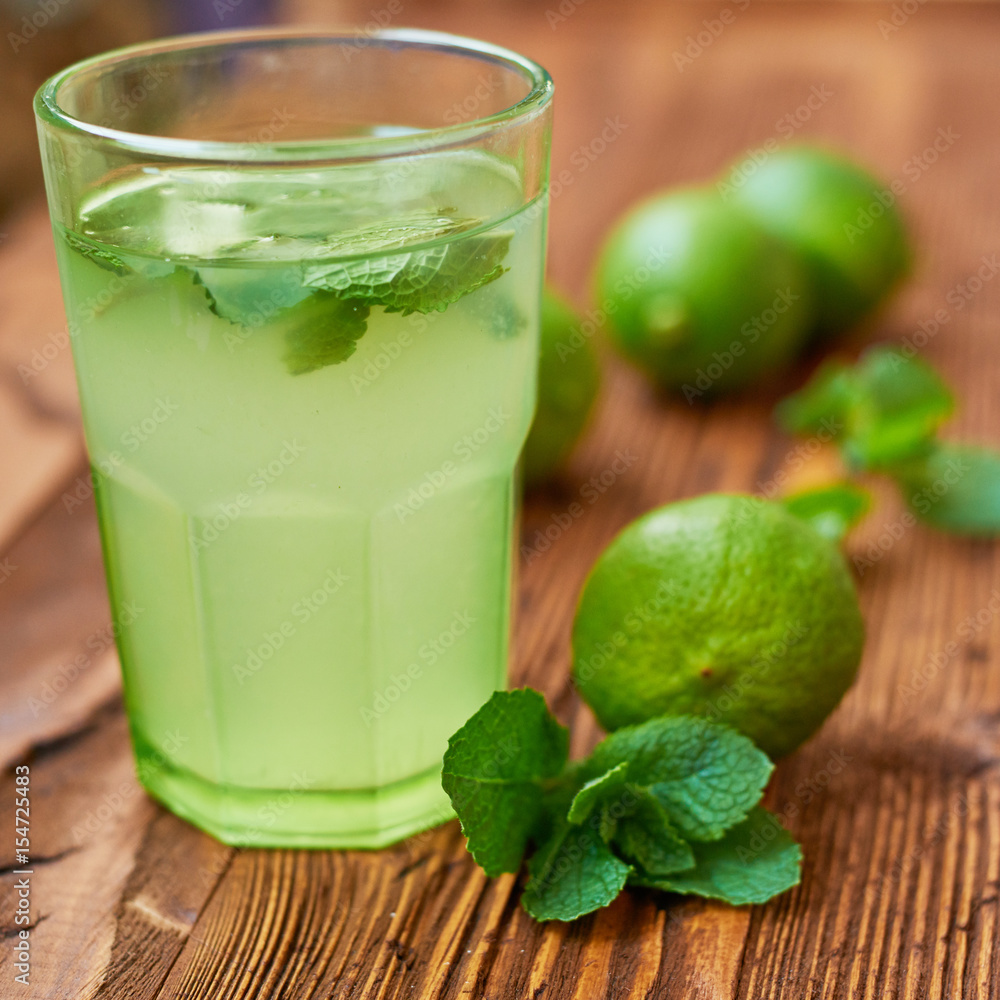 Fresh drink photo of home made limonade on wooden background Fresh drink photo of home made limonade on wooden background