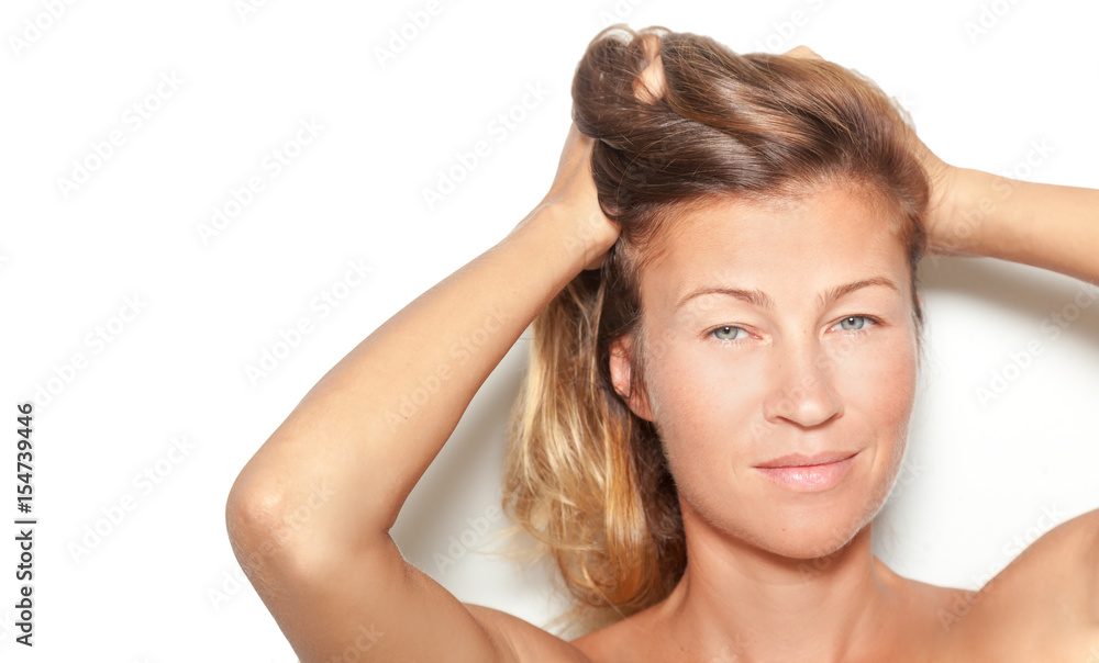 Young beautiful sexy woman on a white background looks at the camera Young beautiful sexy woman on a white background looks at the camera