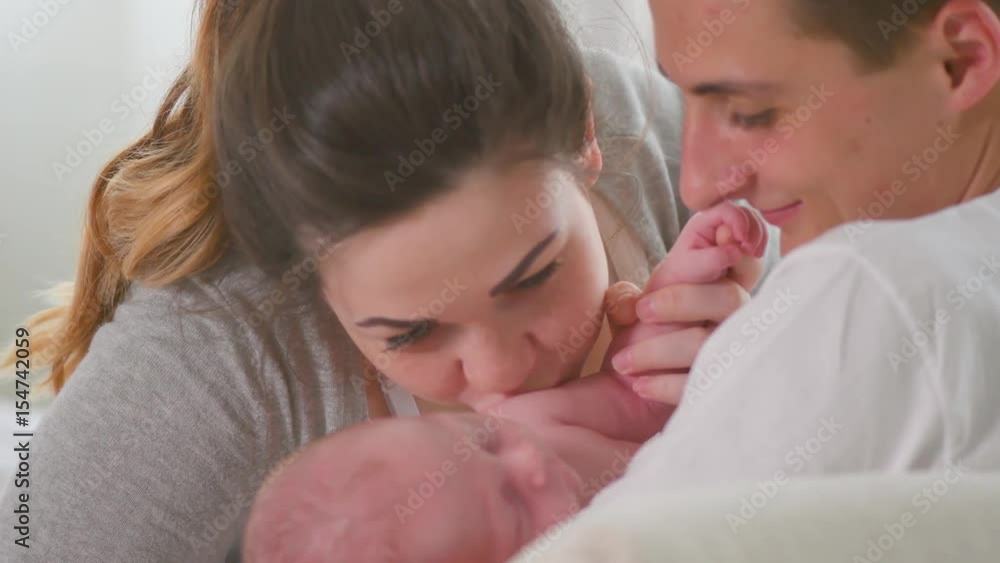 Happy young family. Father, mother and their newborn baby. Parenthood concept. 3840X2160 4K UHD video Happy young family. Father, mother and their newborn baby. Parenthood concept. 3840X2160 4K UHD video