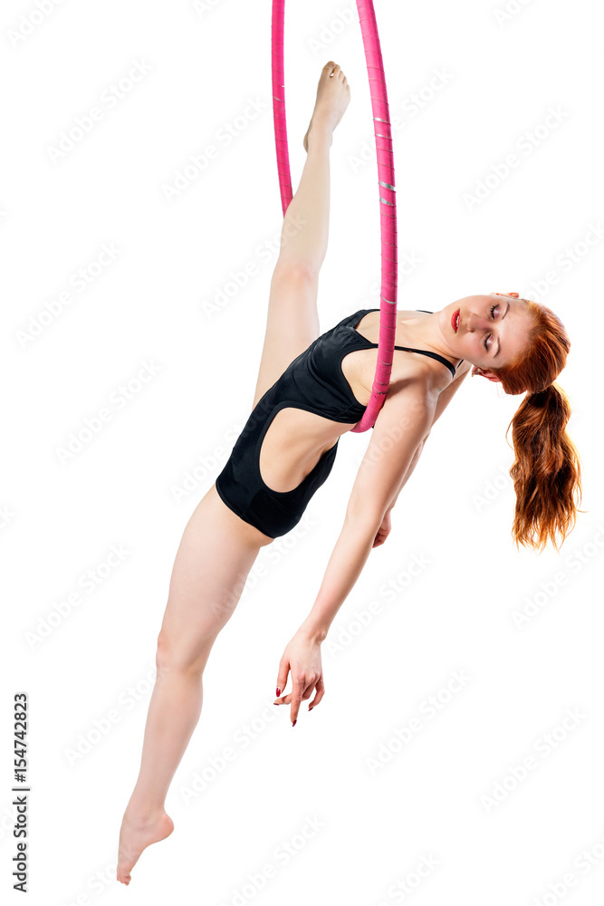 girl in the air ring with a good stretching on a white background girl in the air ring with a good stretching on a white background