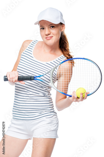 Vertical portrait of a slender tennis player in a cap with a racket isolated © kosmos111