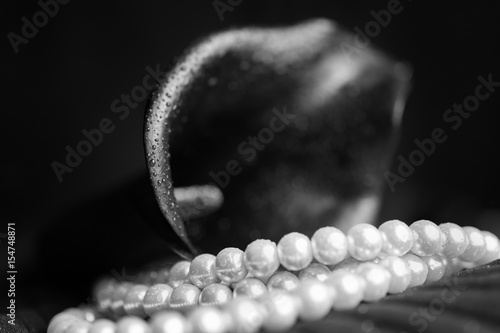 Flower of black calla and white pearl necklace