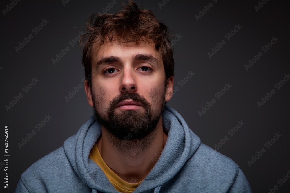 Portrait of young man with beard. Portrait of young man with beard.