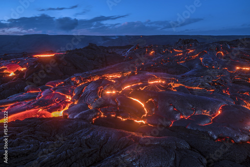 Flowing lava in Hawaii photo