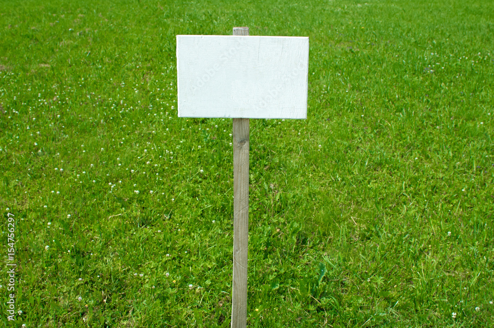 Sign on grass whith isolated space for caption