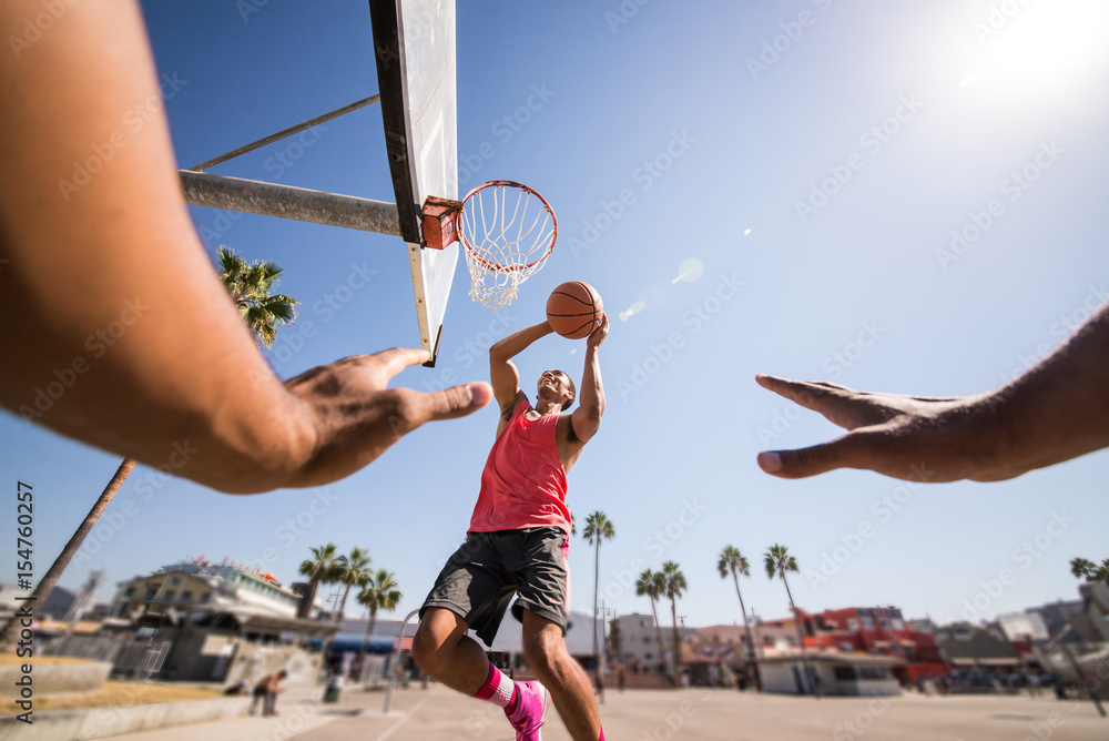 Fototapeta premium Friends playing basketball