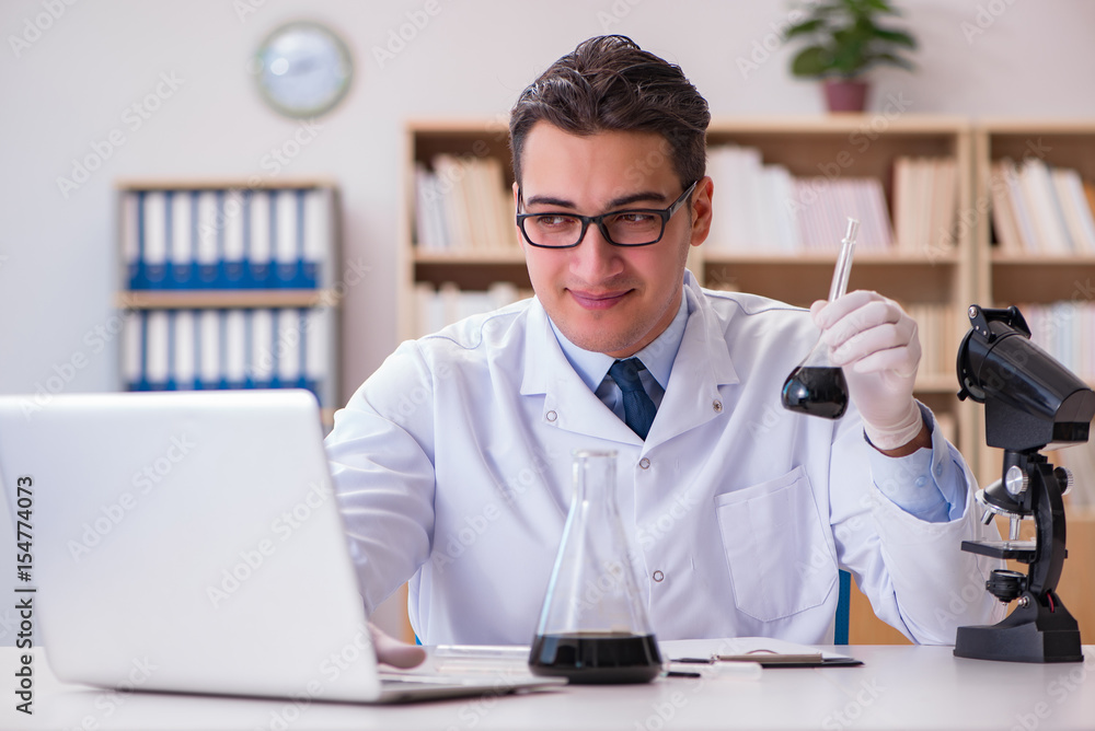 Young lab assistan working in the laboratory Young lab assistan working in the laboratory
