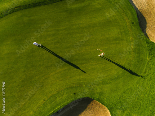 Aerial view of golfers playing on course