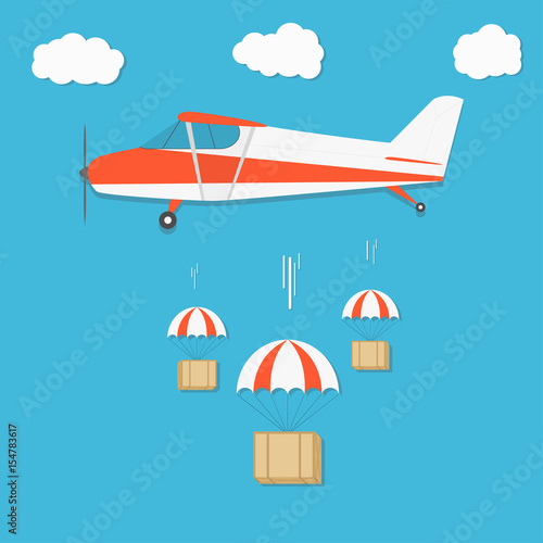 Delivery . Airplane with parachute box packages on blue sky background