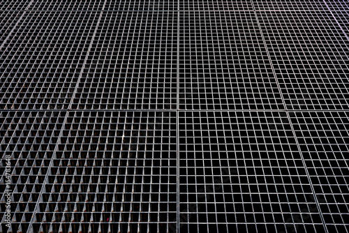 Metal mesh. Metallic background. Metallic mesh with square holes.