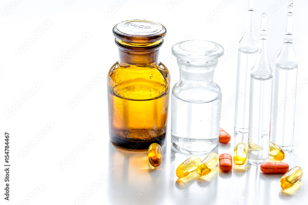 medicine set with pills and vials on doctor's workplace background medicine set with pills and vials on doctor's workplace background