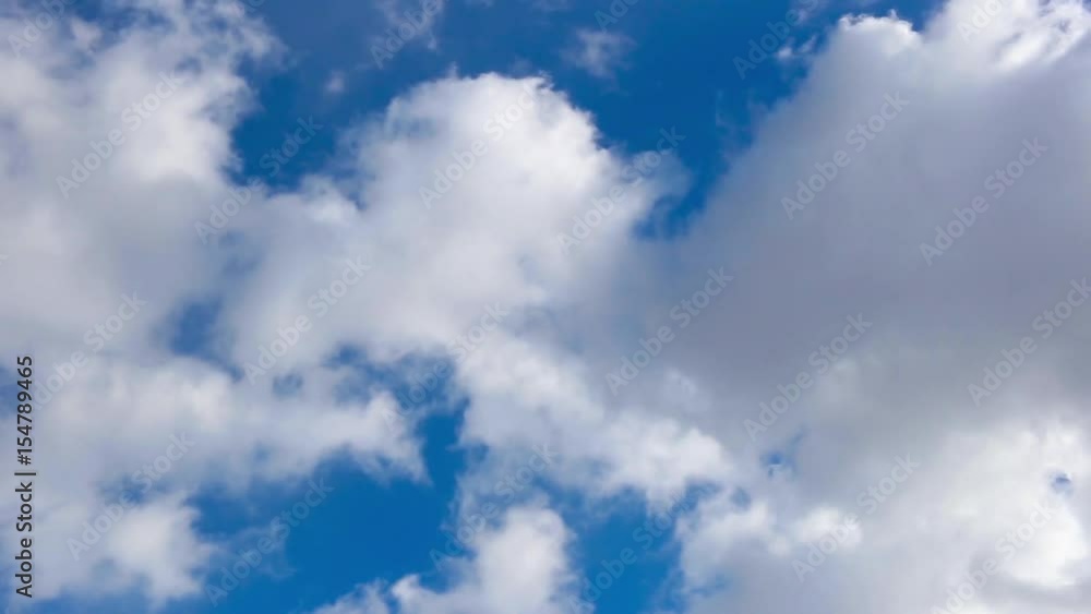 White clouds moving against blue sky White clouds moving against blue sky