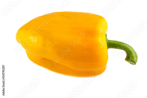 Isolated pepper. One yellow bell pepper isolated on white background photo