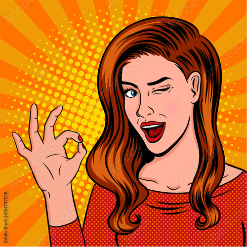 Winking girl pop art. Showing OK sign with speech bubble.