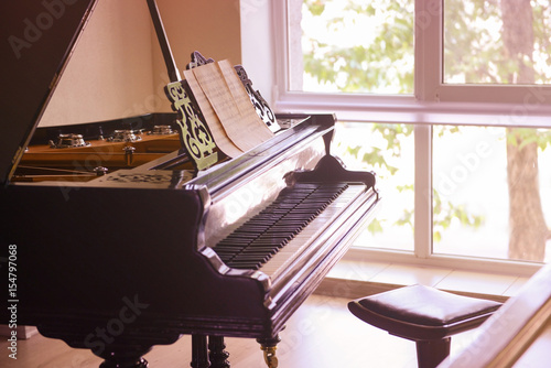 Black piano on light backgr...