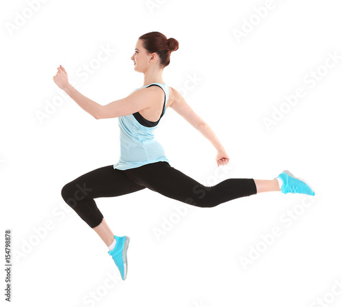 Young beautiful fitness girl training on white background