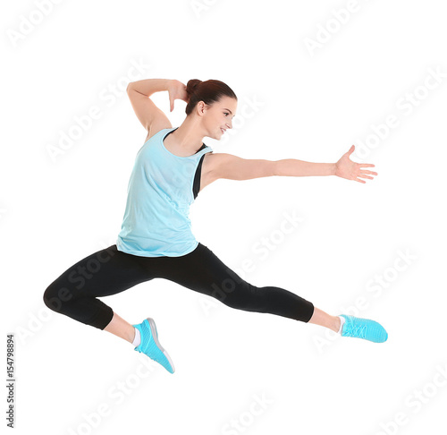 Young beautiful fitness girl training on white background © Africa Studio