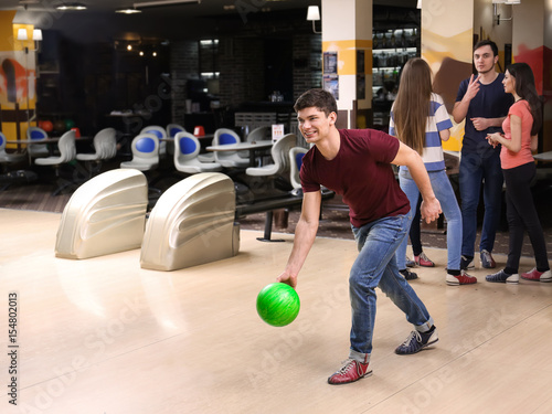 Friends having fun at bowling club