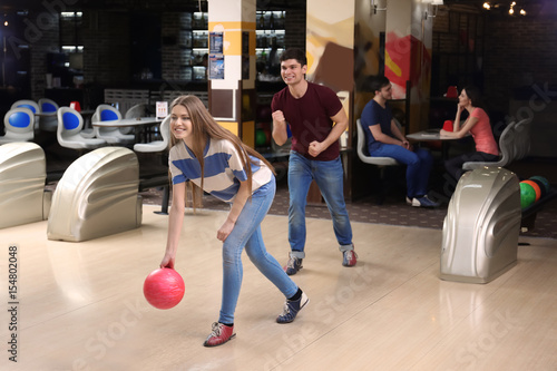 Friends having fun at bowling club