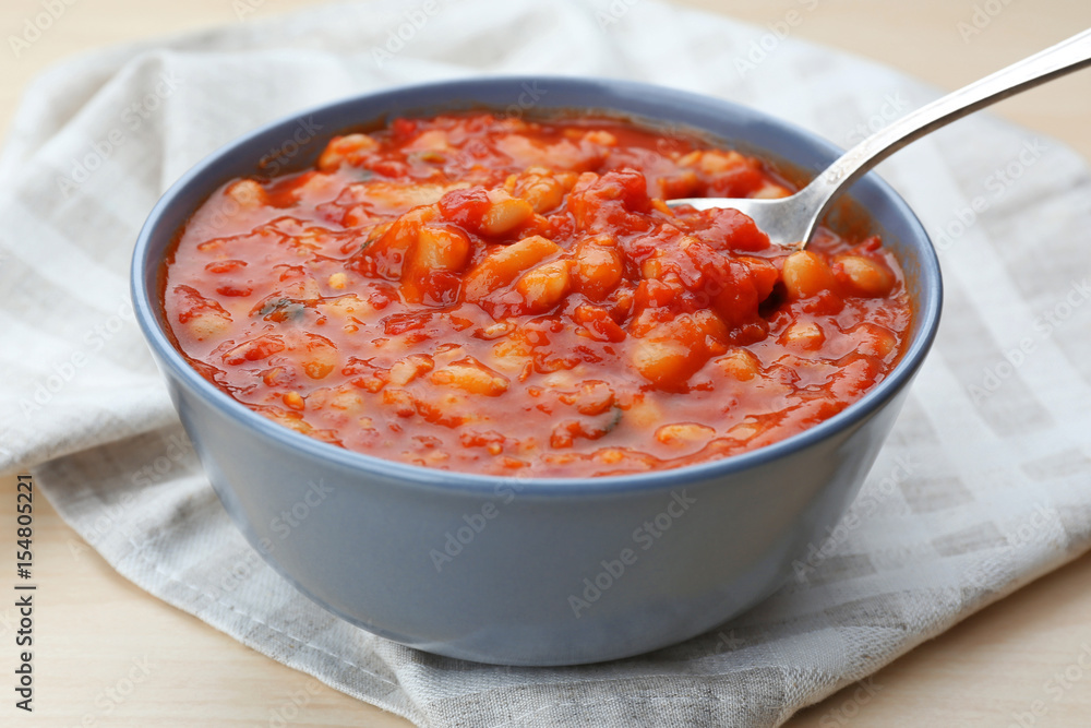 Bowl with delicious Italian butter beans on napkin Bowl with delicious Italian butter beans on napkin