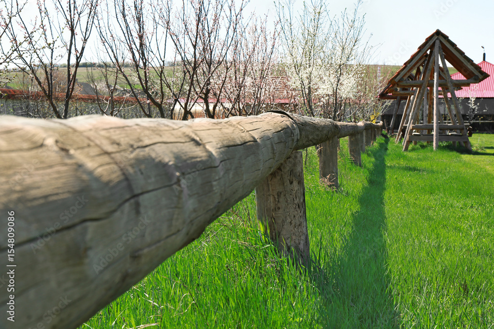 Fototapeta premium Wooden enclosure in orchard on farm