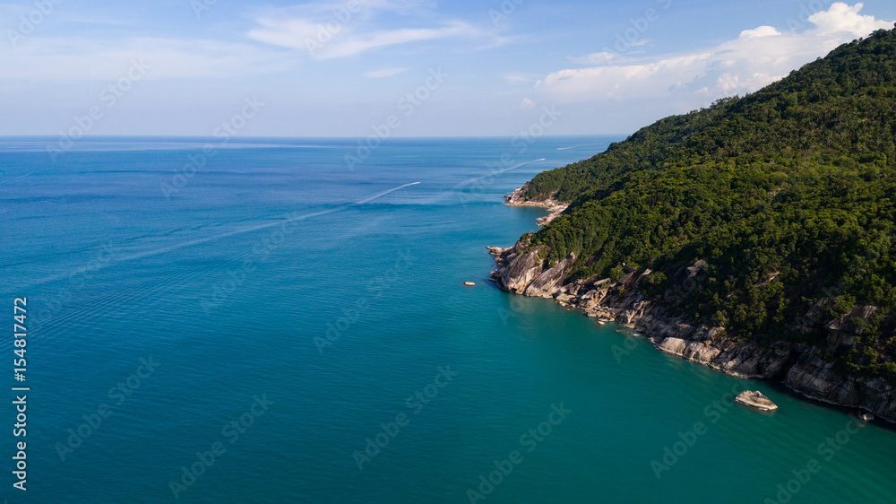 Aerial view of tropical island clear blue sea