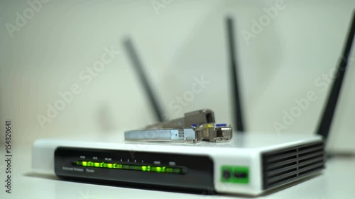 Office Wireless Internet Router for Data Packet Transmission at a Distance, with Three Radio Antennas, Different Frequency of the Signal Transmission Band. For Gadget Connections and Office Techniques